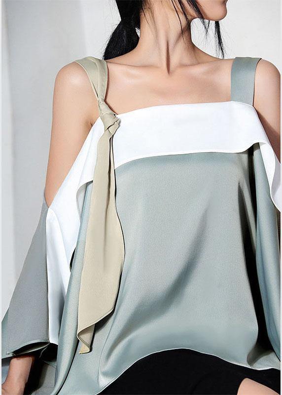 Celeste – Blusa asimétrica en verde claro con tirantes