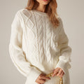 Elzė – Suéter crema con diseño de trenzas