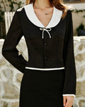 Monique – Camisa negra con cuello blanco en contraste