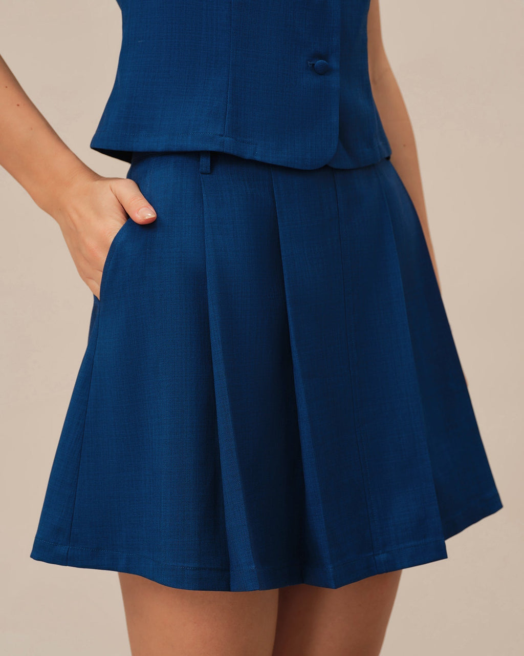 Mini falda azul en corte A con bolsillos