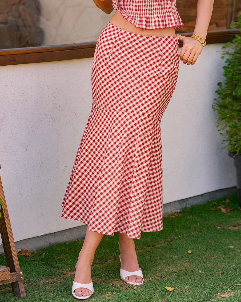 Riva – Falda midi de cuadros en tonos rojos