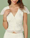 Camiseta de V con bordado de albaricoque